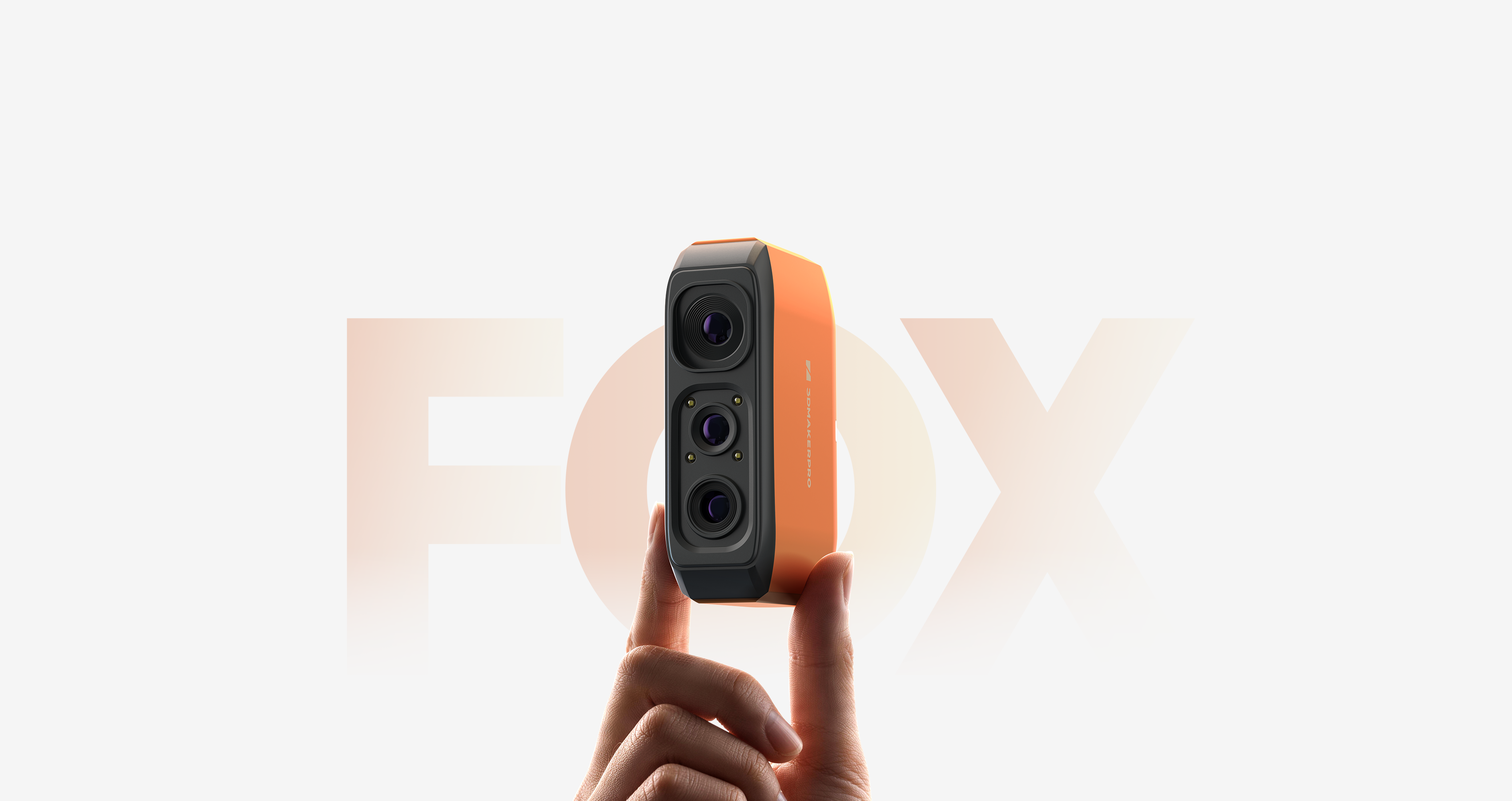 210g ultralight 3DMakerpro EU Fox 3D Scanner in bright orange, easily held by two fingers.
